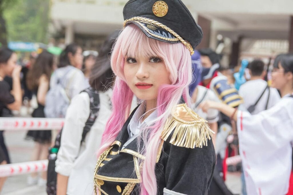 Cosplayer In Detailed Costume Captured Outdoors, Showcasing Vibrant Colors And Creative Design.