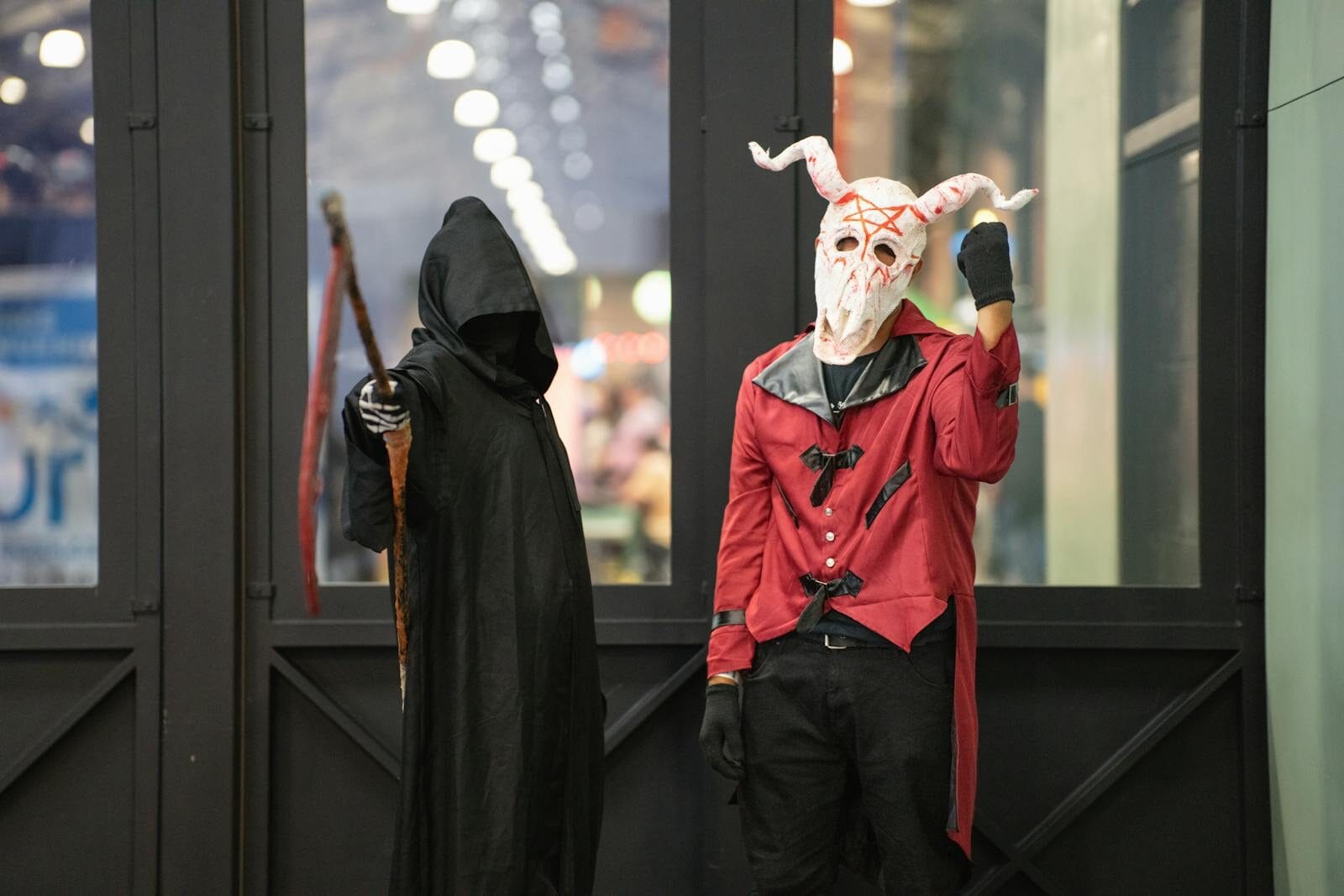 Two cosplayers in detailed costumes at an anime event in San José, Costa Rica.