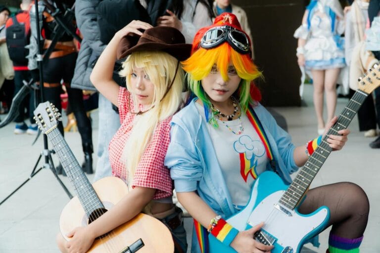 Character Ai Setup Guide Step By Step: 17 Easy &Amp;Amp; Powerful Steps For Beginners 5 Colorful Cosplay Featuring Two Young Adults With Guitars At A Lively Convention Setting.