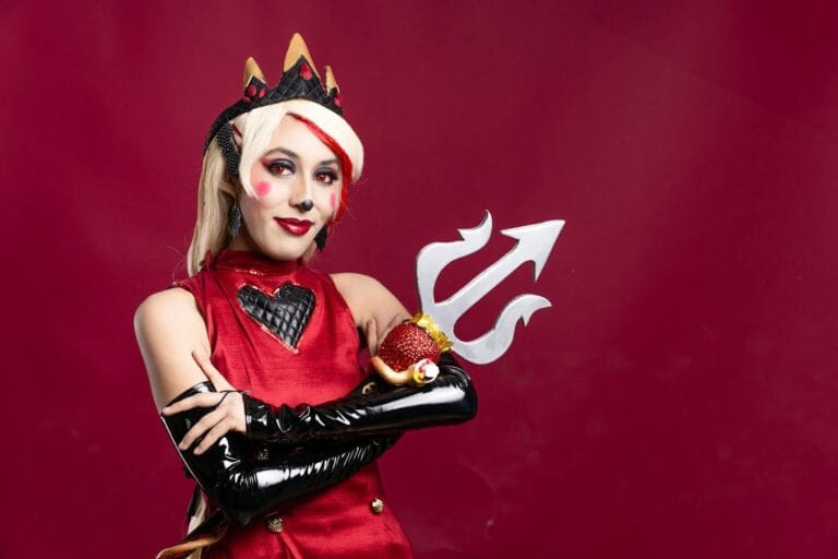 Character Ai Content Rules Explained 46 Striking Cosplay Portrait With Colorful Makeup And A Unique Trident Prop, Shot In A Studio Setting.
