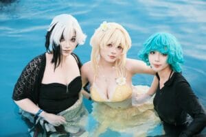 Three individuals in colorful cosplay outfits enjoying a pool setting, showcasing unique fashion and creativity.