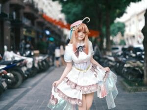 A stylish cosplay character in a vibrant outfit posed on a bustling street.