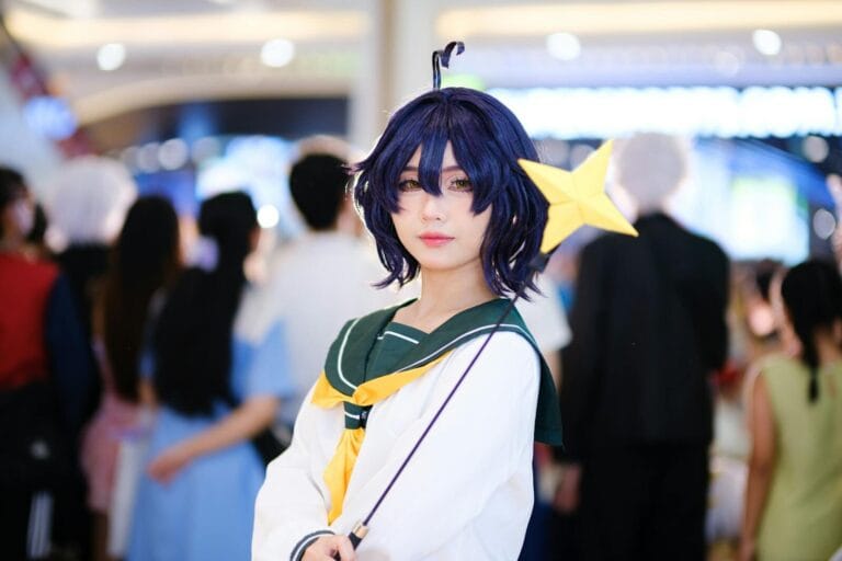 Character Ai Advanced Tips For Power Users 9 Cosplayer Dressed As Anime Character With A Star Wand At A Bustling Indoor Event.