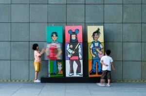 girl in white shirt standing beside girl in yellow dress